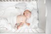 Little,baby,sleeping,in,crib,,,top,view