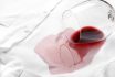 Overturned,glass,and,spilled,exquisite,red,wine,on,white,shirt.