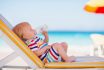 Portrait,of,baby,on,sunbed,drinking,water