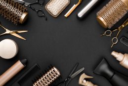 Hairdresser,tools,on,black,background,with,copy,space,in,center