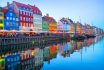 People,walking,and,sitting,in,restaurants,at,illuminated,nyhavn,embankment