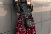 Woman,with,coffee,in,fashionable,leather,jacket,and,stylish,plaid