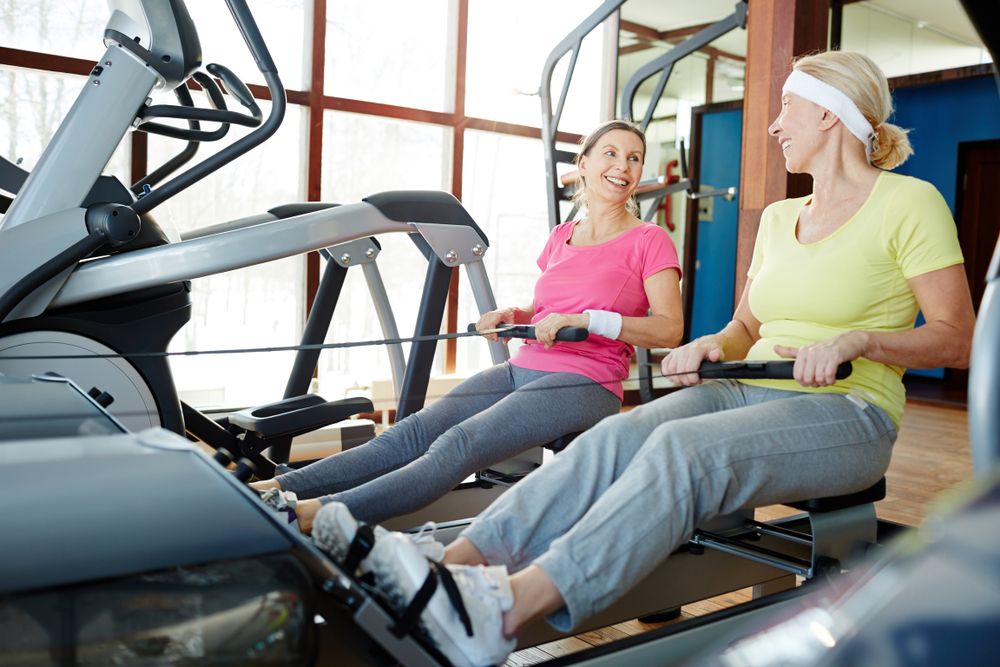 Healthy,senior,females,in,activewear,looking,at,one,another,during
