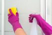 Female,hands,cleaning,white,,transparent,shower,cabin,with,yellow,and