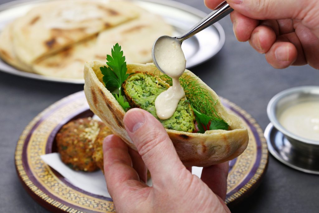 Egyptian,falafel,served,in,a,pita,bread,with,tahini,sauce