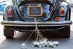 Vintage,wedding,car,with,just,married,sign,and,cans,attached