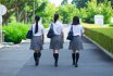 Back,view,of,a,walking,high,school,girl