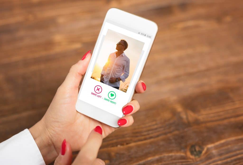 Woman,using,dating,app,and,swiping,user,photos