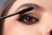 Closeup,of,eye,makeup.,applying,maskara,on,lushes,young,woman
