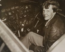 Amelia,earhart,sitting,in,the,cockpit,of,her,lockheed,electra