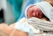Newborn,baby,boy,laying,down,on,mother's,breast.,the,mother