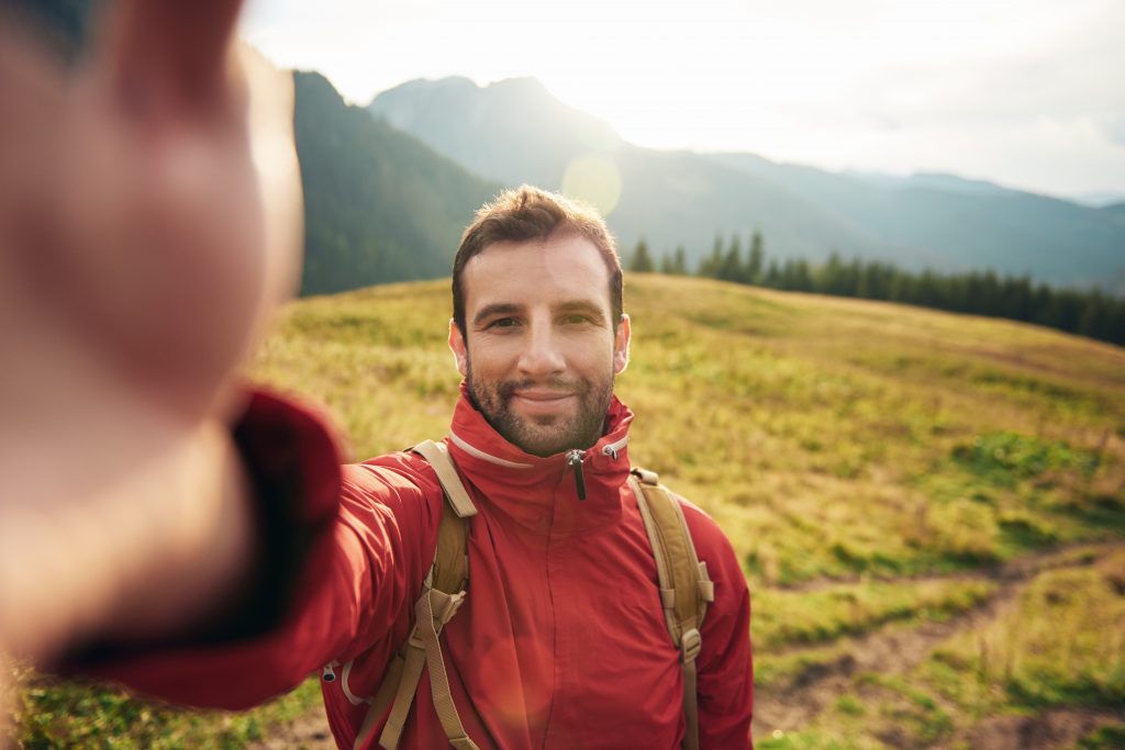 Hiker,taking,a,selfie,while,out,trekking,in,the,wilderness