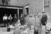 Prohibition,agents,stand,with,boxes,and,bottles,of,wine,and