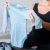 Pregnant Woman Packing Baby Stuff For Hospital