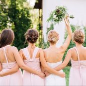 Bride,standing,with,her,back,in,a,white,wedding,dress