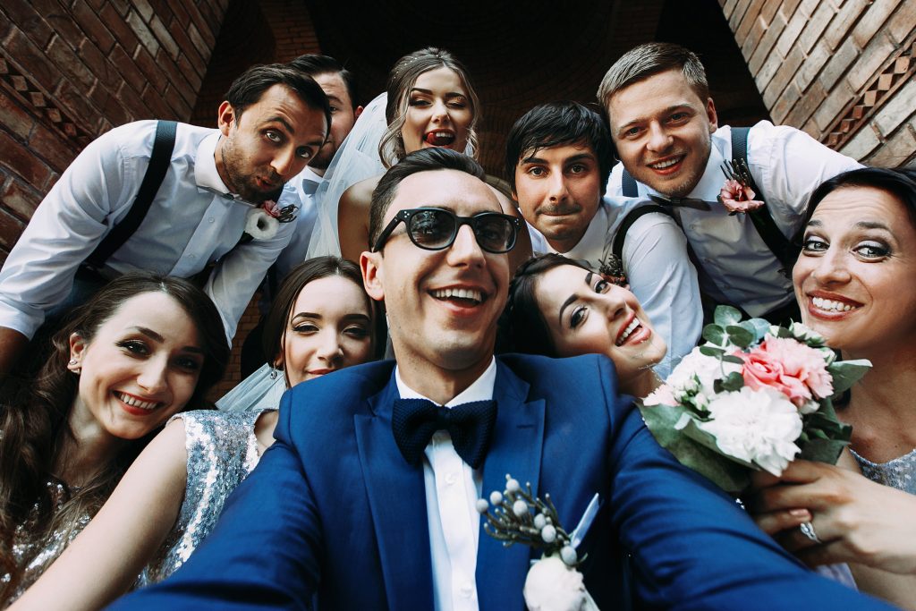 Handsome,groom,selfie,with,fun,beautiful,bridesmaids,&,groomsmen