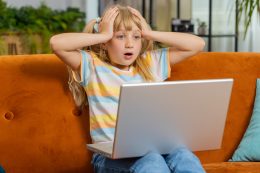 Toddler Teenager Girl Use Laptop Surprised By Bad News, Fortune Loss, Fail, Lottery Results At Home