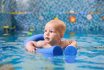 Adorable Little Boy Swimming In Pool With Pool Noodle.