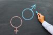 A Man's Hand With Chalk Draws A Male And Female Gender Symbol On A Chalkboard, The Concept Of Sexual Education