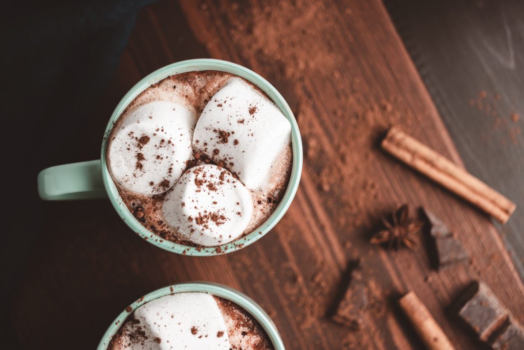 Hot Chocolate Drink With Marshmallow In A Cup On Wooden Board With Cinnamon And Star Anise, Top View
