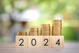 2024 New Year, New Year Economy Growth, Planning To Get Money For Prepare Family Or Life Budget, Annual Tax, Business And Investment Concept. Growth Of Coins Stack On Wood Blocks Number 2024.