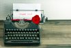 Vintage Typewriter With Paper Page And Rose Flower
