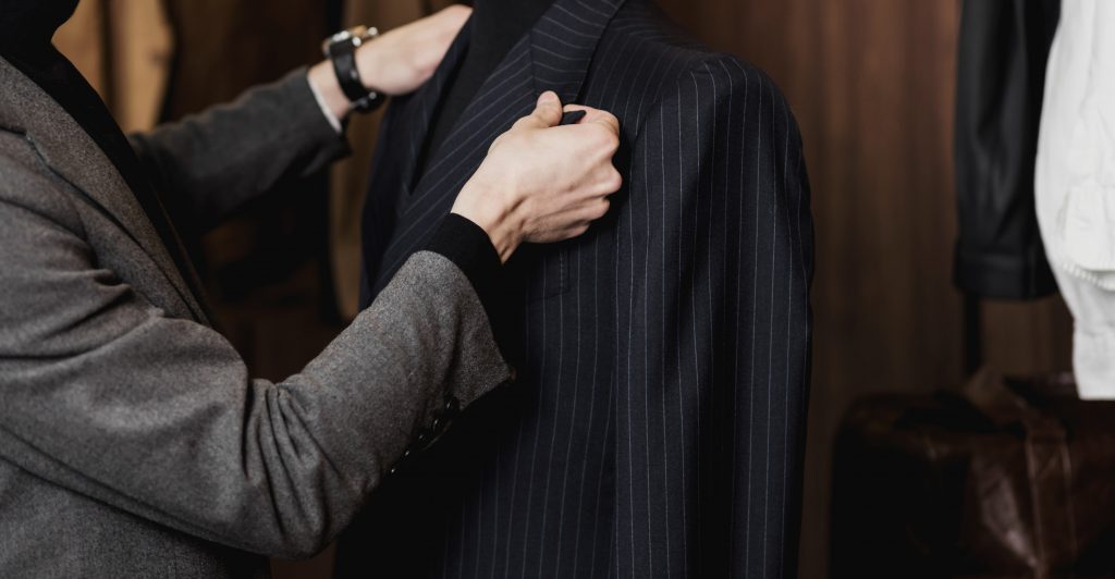 Tailor Working On Custom Made Suit