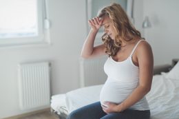 Pregnant Woman Suffering With Headache And Nausea