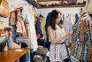 Young Woman Shopping Something In A Vintage Clothing Store