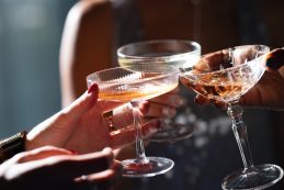 Close Up Photo Of Group Of Women’s Hands Toasting With Wine Glasses During A New Year Celebration