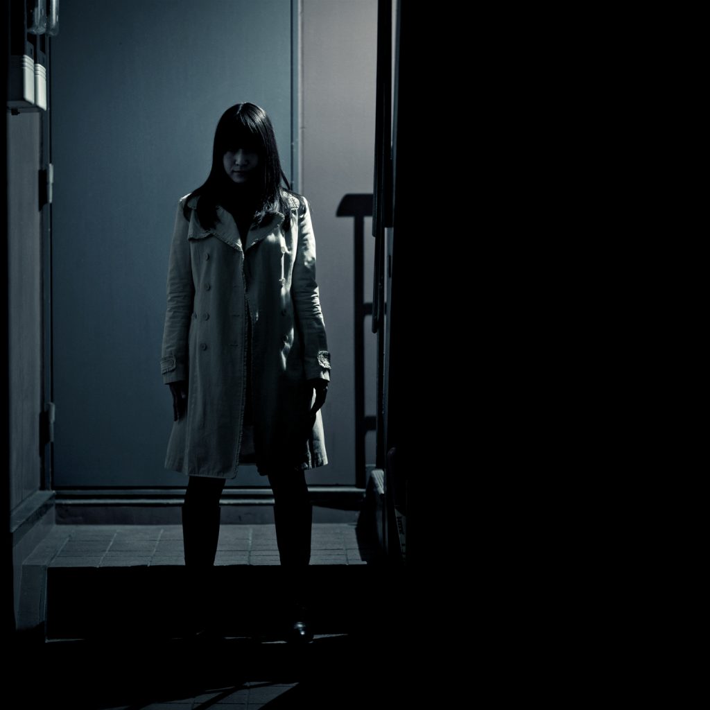 Spooky Japanese Girl At The Entrance Of Building