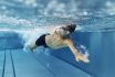 Teenage Boy Swimming Crawl In Pool