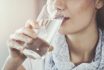 Young Woman Drinking Pure Glass Of Water