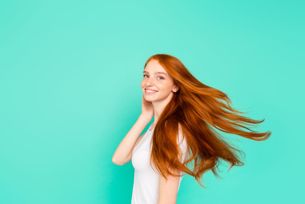 Profile Side View Photo Of Tenderness, Tender, Romantic, Romance Person Look At Camera Isolated On Shine Teal Background, Hold Hand Near Cheek Turn And Make Hair Light, Airy