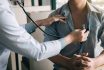 Asian Doctor Is Using A Stethoscope Listen To The Heartbeat Of The Elderly Patient.