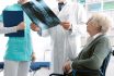 Doctor Checking A Senior Female Patient's X Ray Image During A Visit At The Hospital, Injury And Osteoporosis Concept