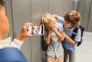 Schoolchildren Cruel Boys Filming On The Phone Torturing Bullying Their Classmate In School Hall. Puberty Difficult Age