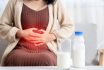 Woman Holding Stomachache After Drinking A Glass Of Cow Milk Feeling Bad, Discomfort Because Of Expired Date, Indigestion Concept