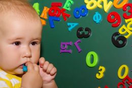 Funny Baby Girl Playing With Letters