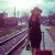 Sensual Woman Pulling Suitcase On The Railroad Station