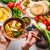 Healthy Vegetarian Food Background. Vegetables, Pesto And Lentil Curry With Tofu.