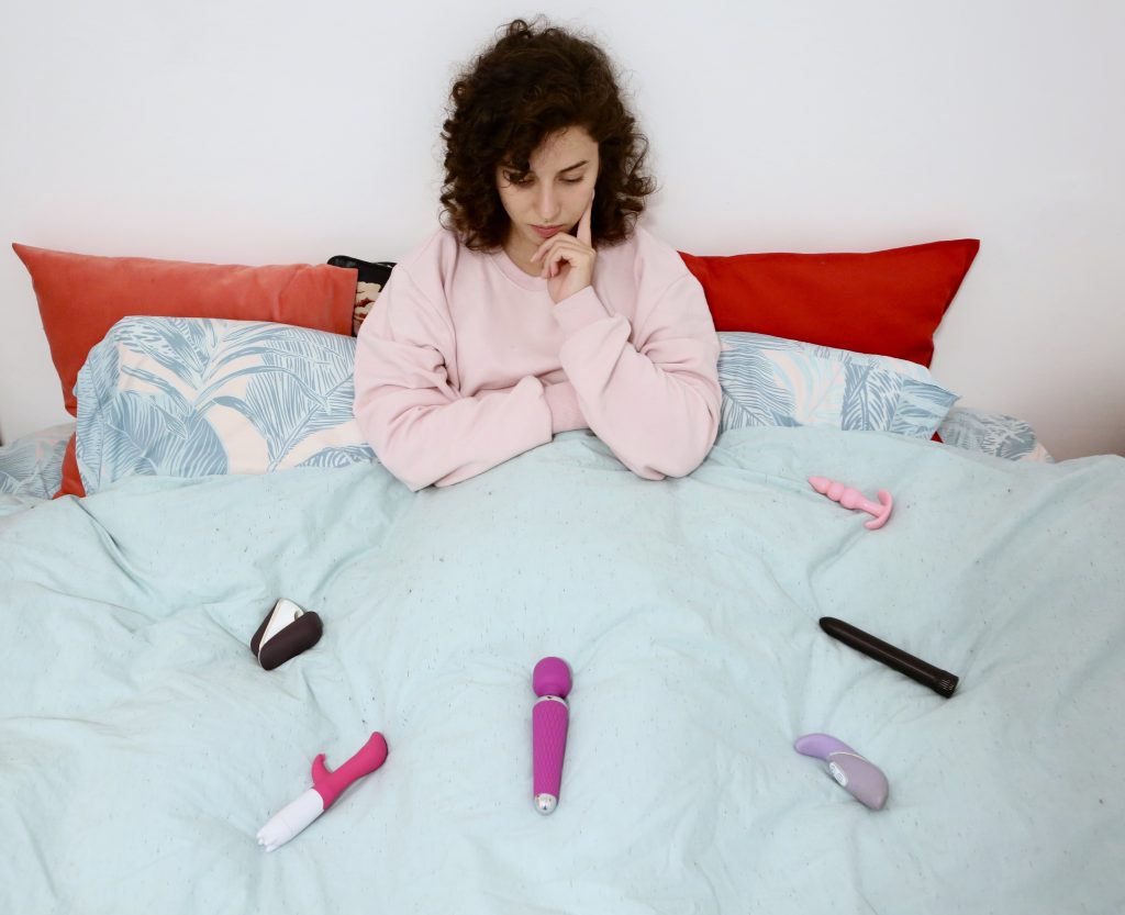 A Girl In The Bed With Sex Toys