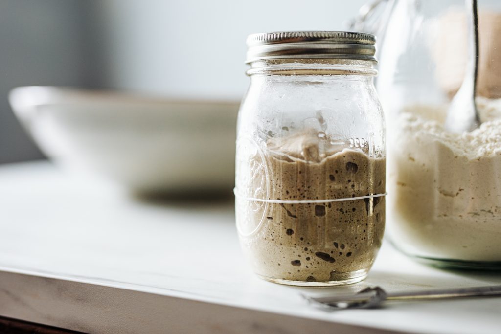 Close Up Of Sourdough Starter In Jar On Counter