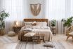 Rustic Home Design With Ethnic Boho Decoration. Bed With Pillows, Wooden Furniture