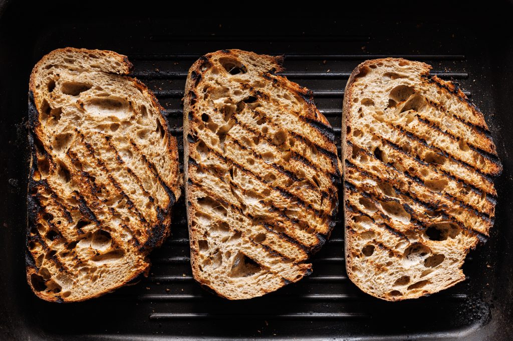 Grilled Slices Of Sourdough Bread On The Grill Plate