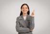 Confident Woman In Checkered Jacket Crossing Fingers With A Smile