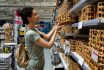 Adult Woman Selecting Home Decor In Shopping Mall