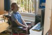 Young Disabled Man Playing Computer Game