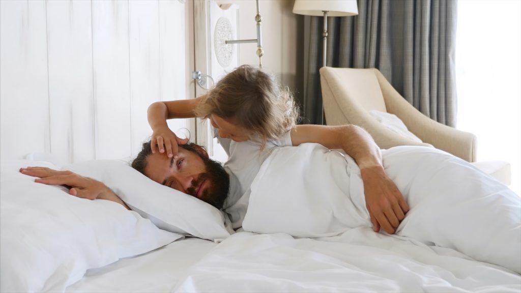 Daughter Comes To Sleeping Father And Opens His Eyes By Hands For Wakes Him