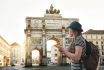 A Tourist Girl With A Backpack Looks Sights In Munich In Germany